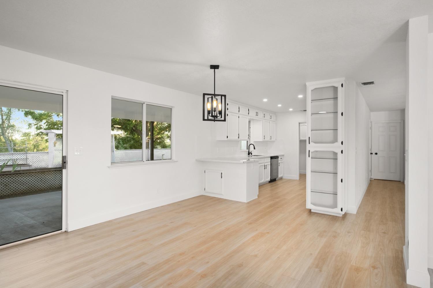 42906 Ranger Cir Drive Coarsegold, CA 93614 - Photo 9 of 29 a view of a kitchen with refrigerator and window