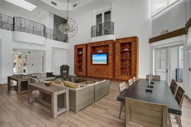 a view of a patio with a table and chairs under an umbrella