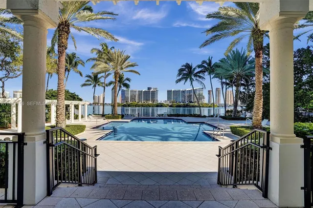 a view of a city with tall buildings and a bench