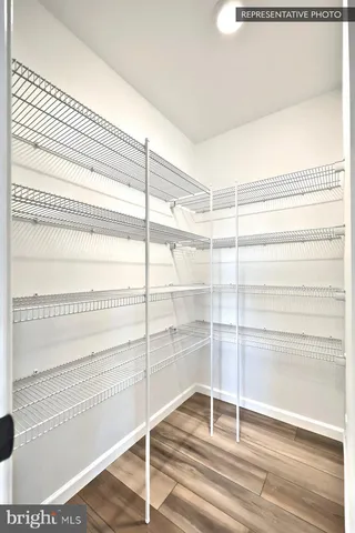 a view of an entryway with wooden floor