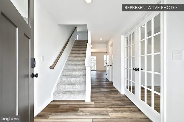 a view of staircase with white walls
