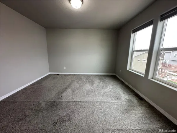 an empty room with windows