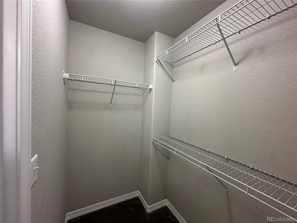 a view of a room with racks on the wall