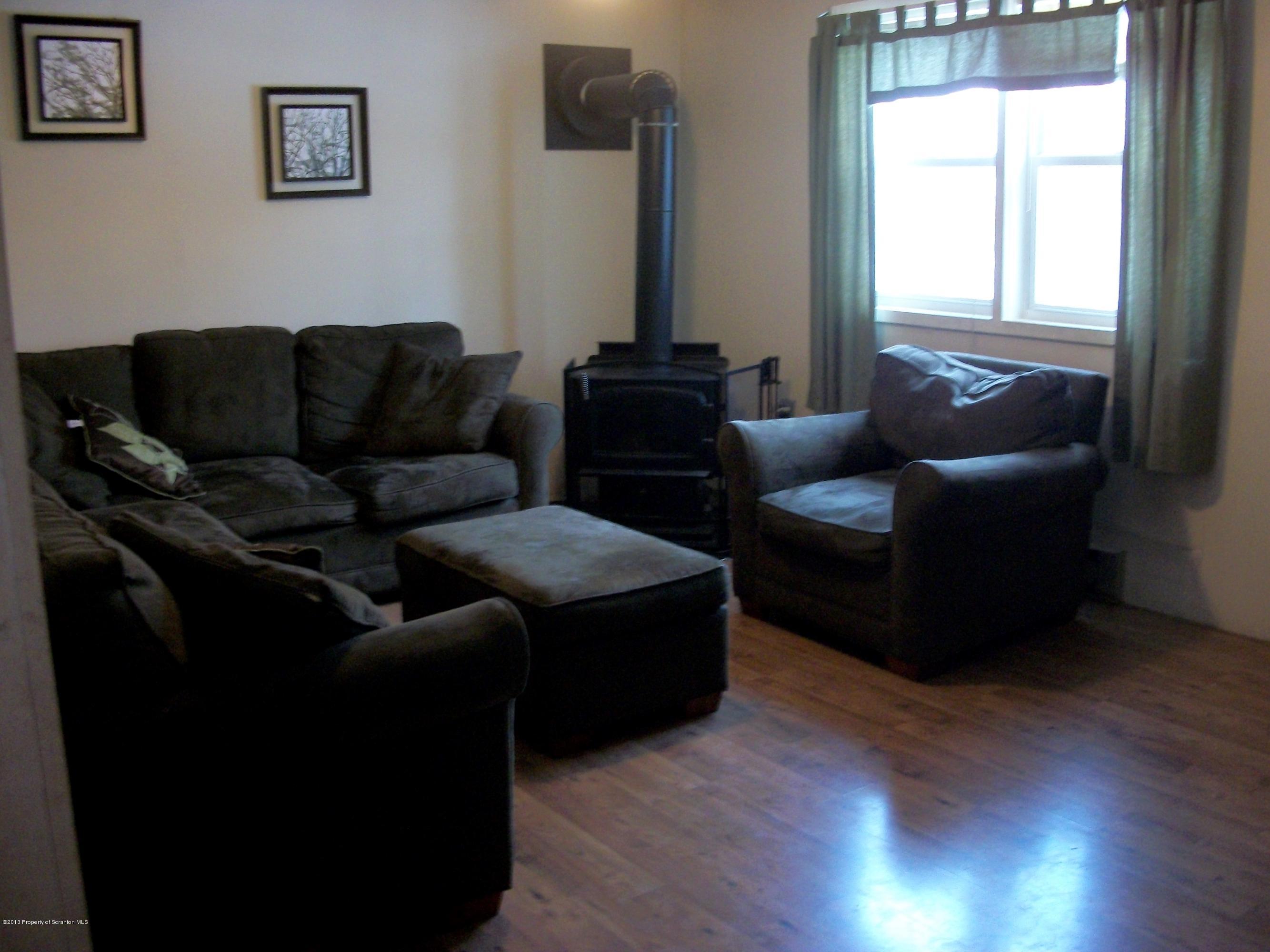 948 State Rte 3010 Springville, PA 18844 - Photo 6 of 7 a living room with furniture and a window