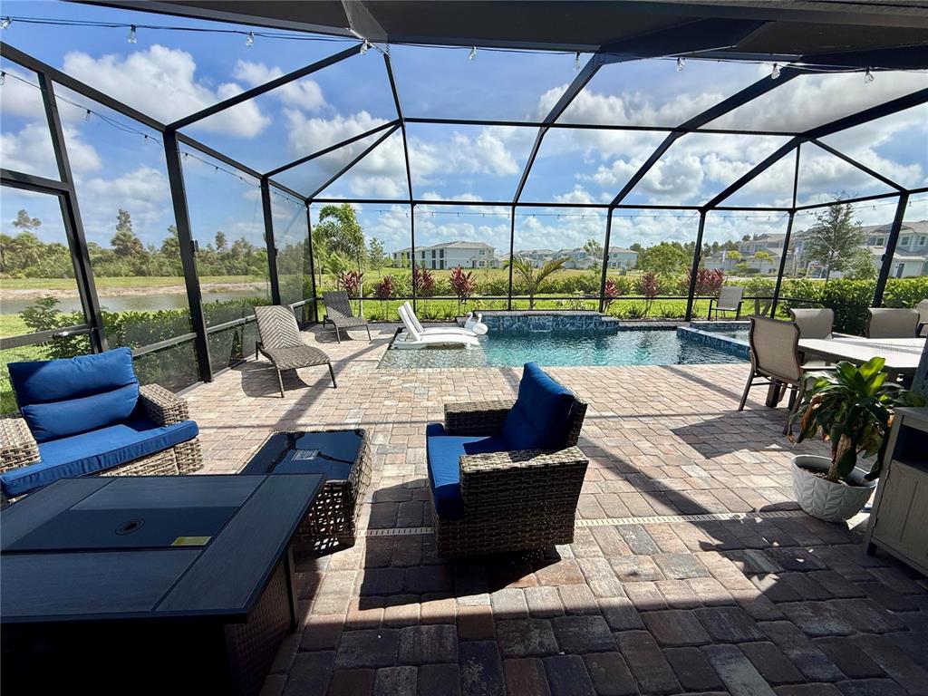 10852 Sun Drop Street Venice, FL 34293 - Photo 2 of 15 a view of a patio with wooden floor and outdoor seating