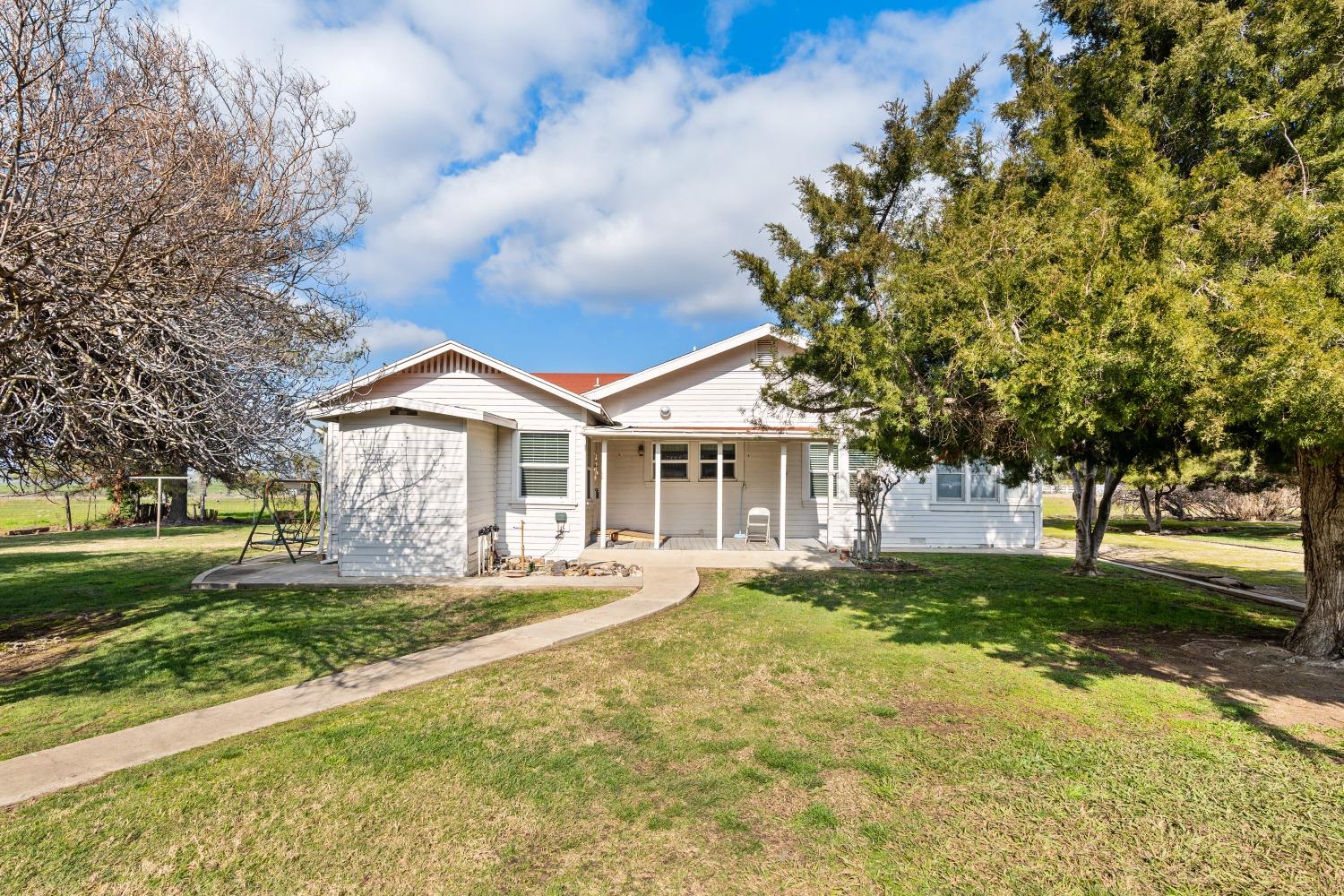 1790 North Piedra Road Sanger, CA 93657 - Photo 1 of 32 a front view of a house with a yard