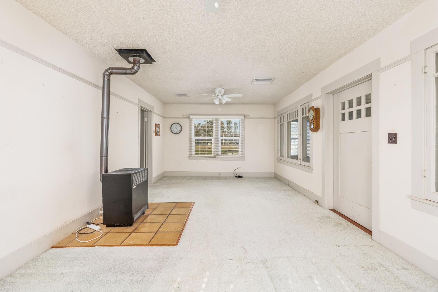 1790 North Piedra Road Sanger, CA 93657 - Photo 5 of 32 a view of an empty room with a window