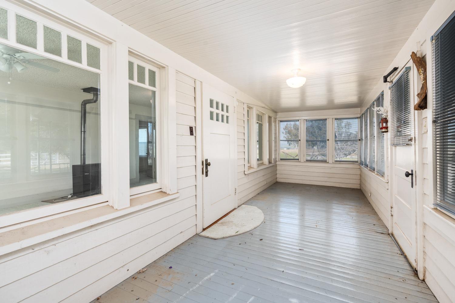 1790 North Piedra Road Sanger, CA 93657 - Photo 7 of 32 a view of a large room with wooden floor and windows