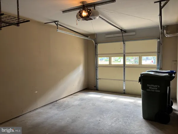 a view of a garage with an empty space