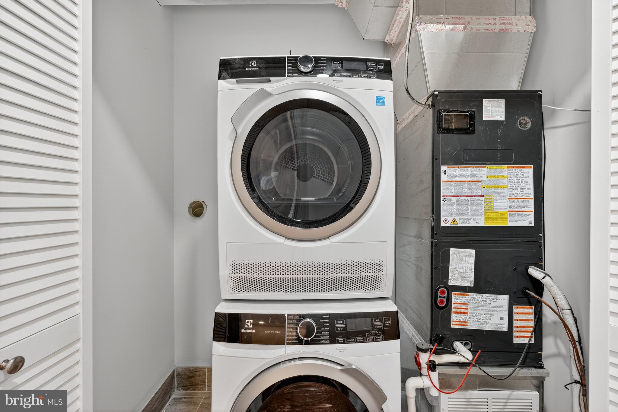 2932 Nelson Place Southeast, Unit 1 Washington, DC 20019 - Photo 17 of 18 a view of livingroom with washer and dryer