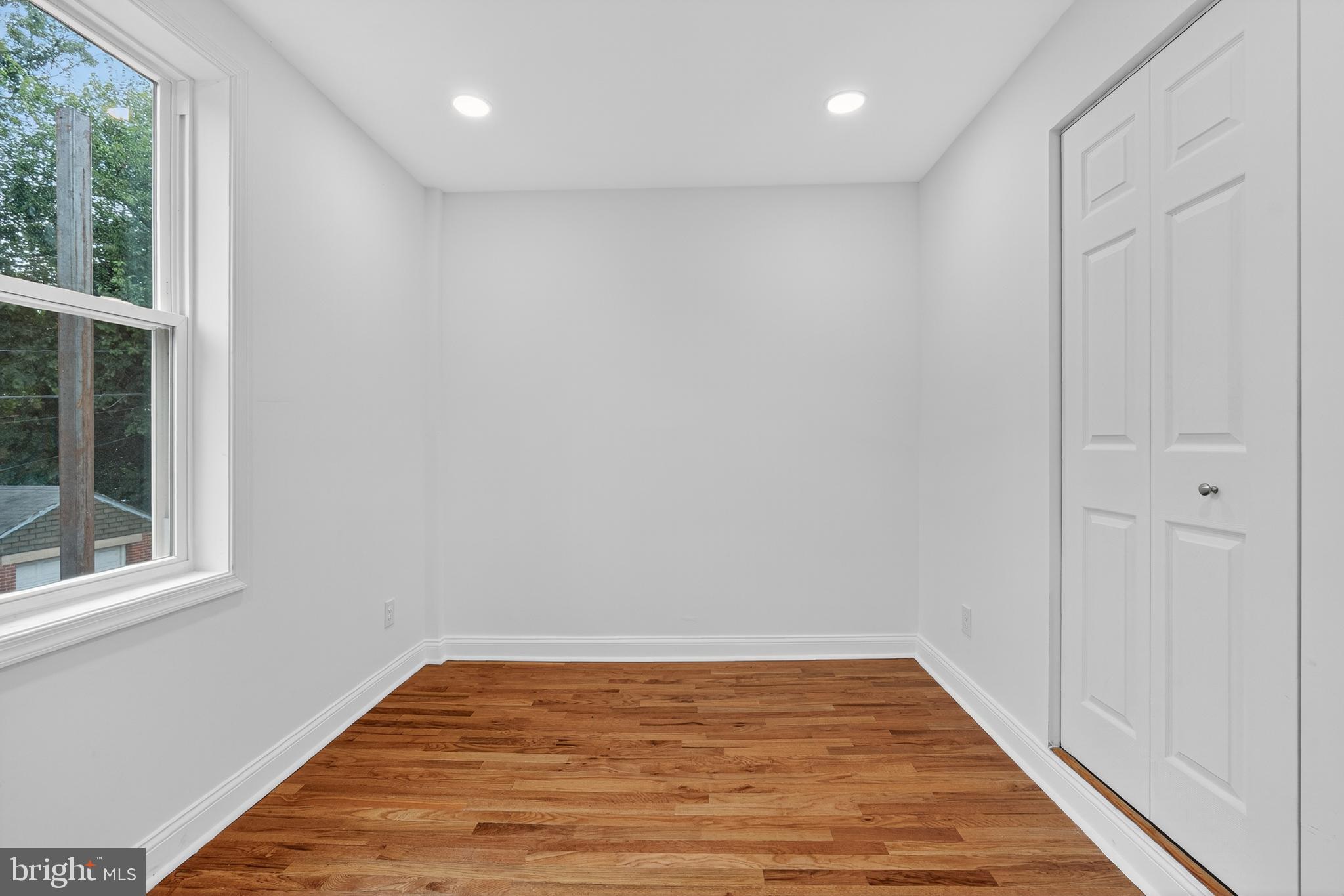2932 Nelson Place Southeast, Unit 1 Washington, DC 20019 - Photo 8 of 18 a view of room with window and wooden floor