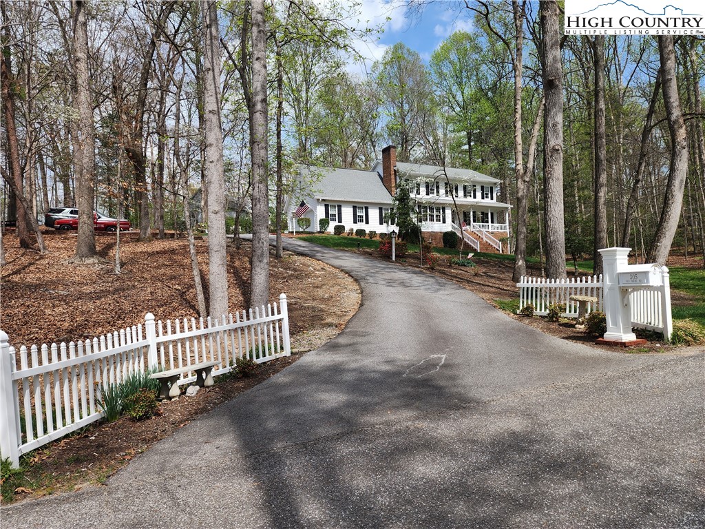 a view of a park with iron fence