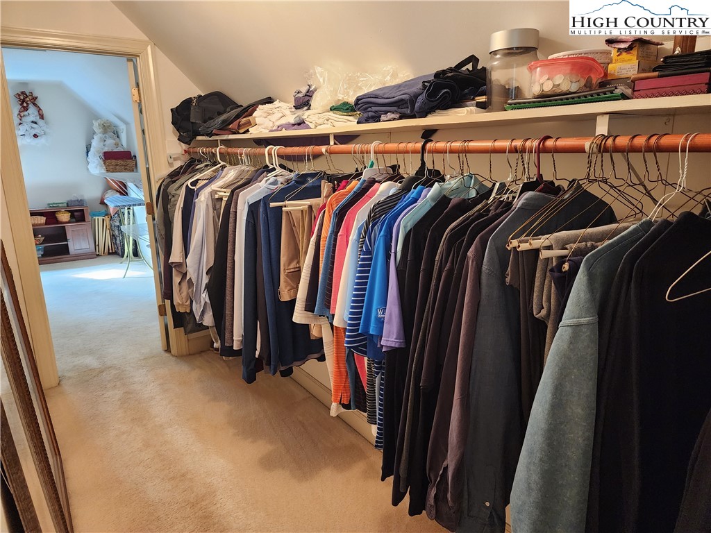 305 Old Farms Road Wilkesboro, NC 28697 - Photo 35 of 50 a view of walk in closet with clothes and shoes