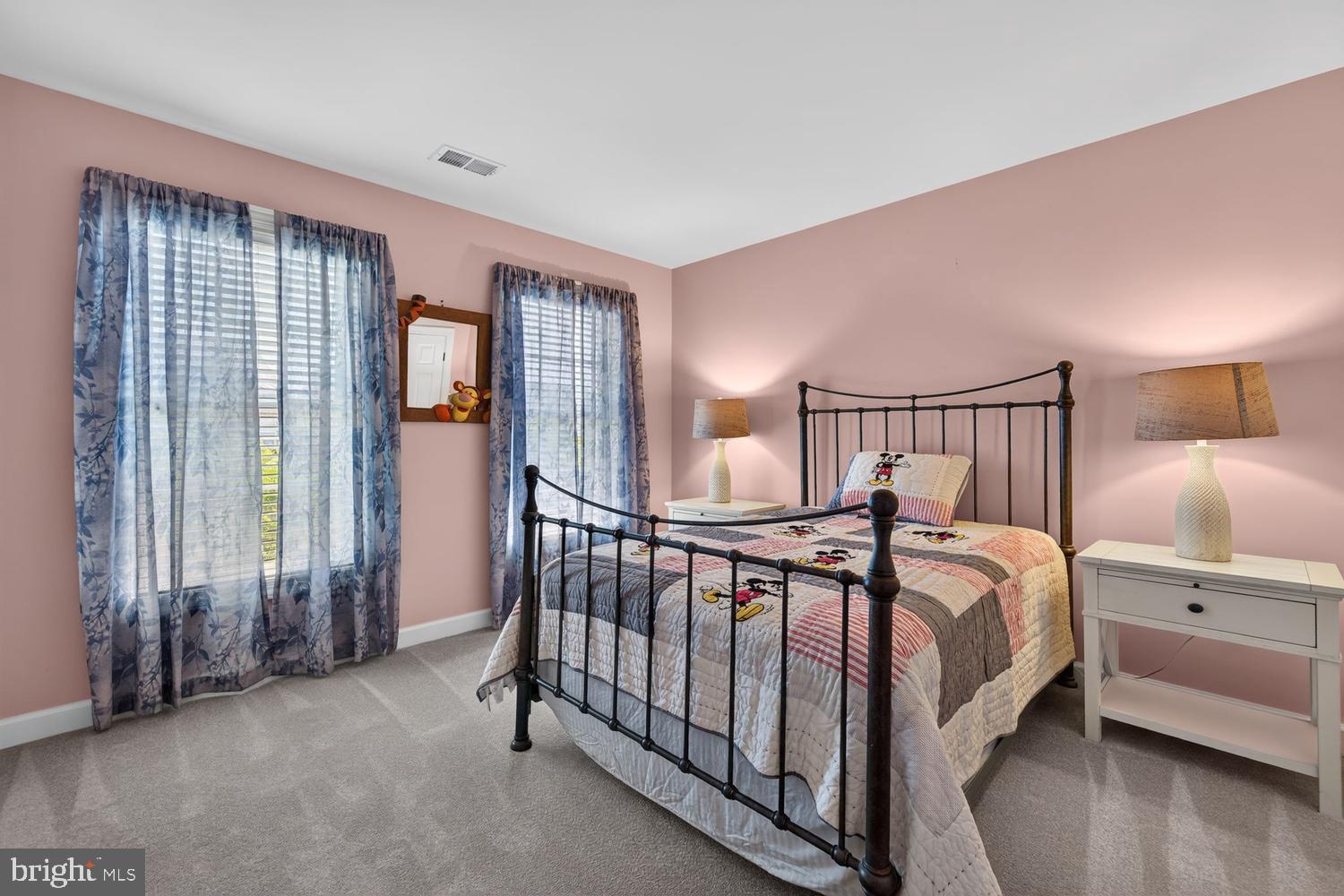 23106 Birch Mead Road Clarksburg, MD 20871 - Photo 25 of 60 a bedroom with a bed and a chandelier