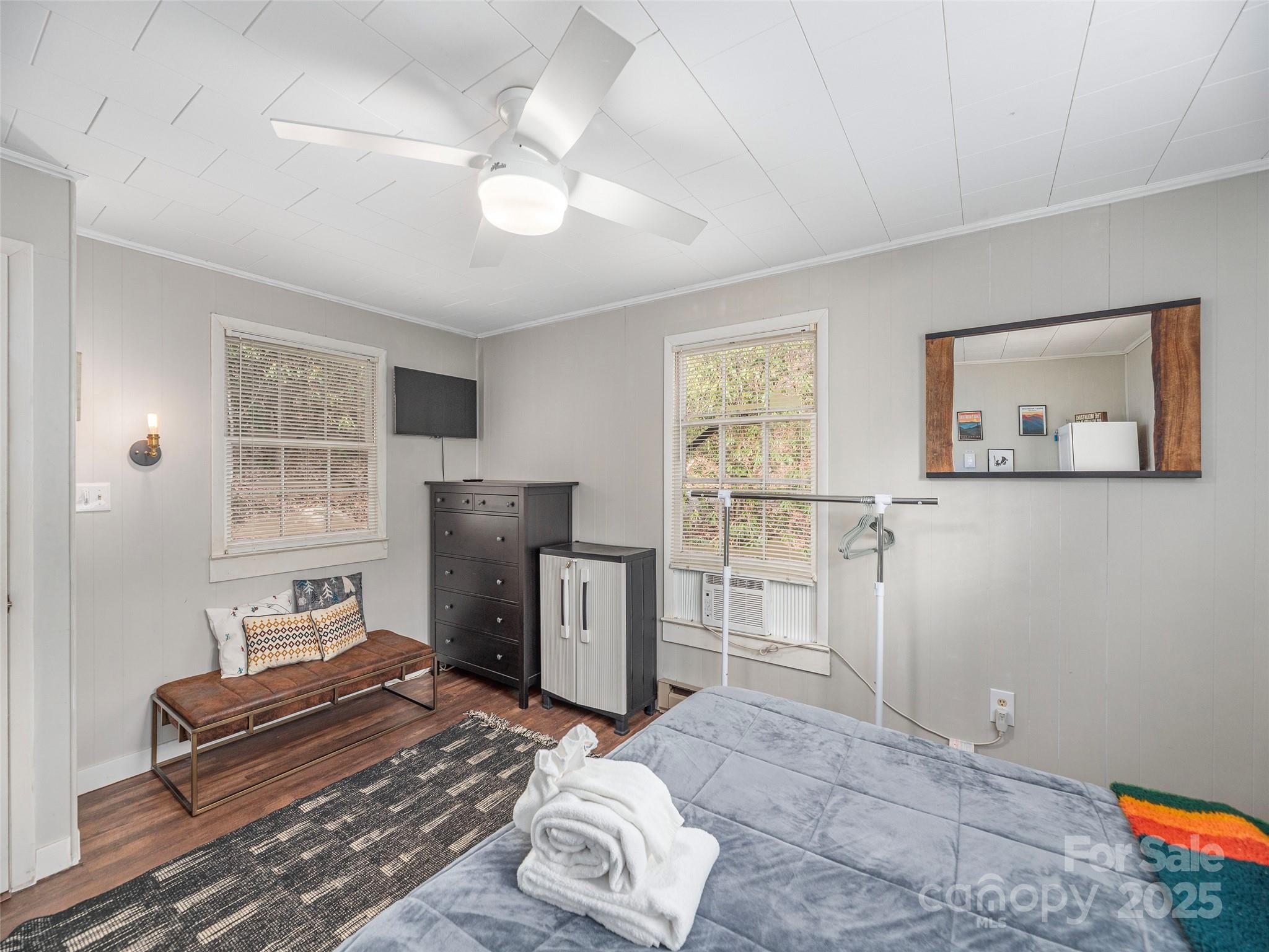 155 Mull Cove Road Maggie Valley, NC 28751 - Photo 11 of 19 a bedroom with furniture and a window