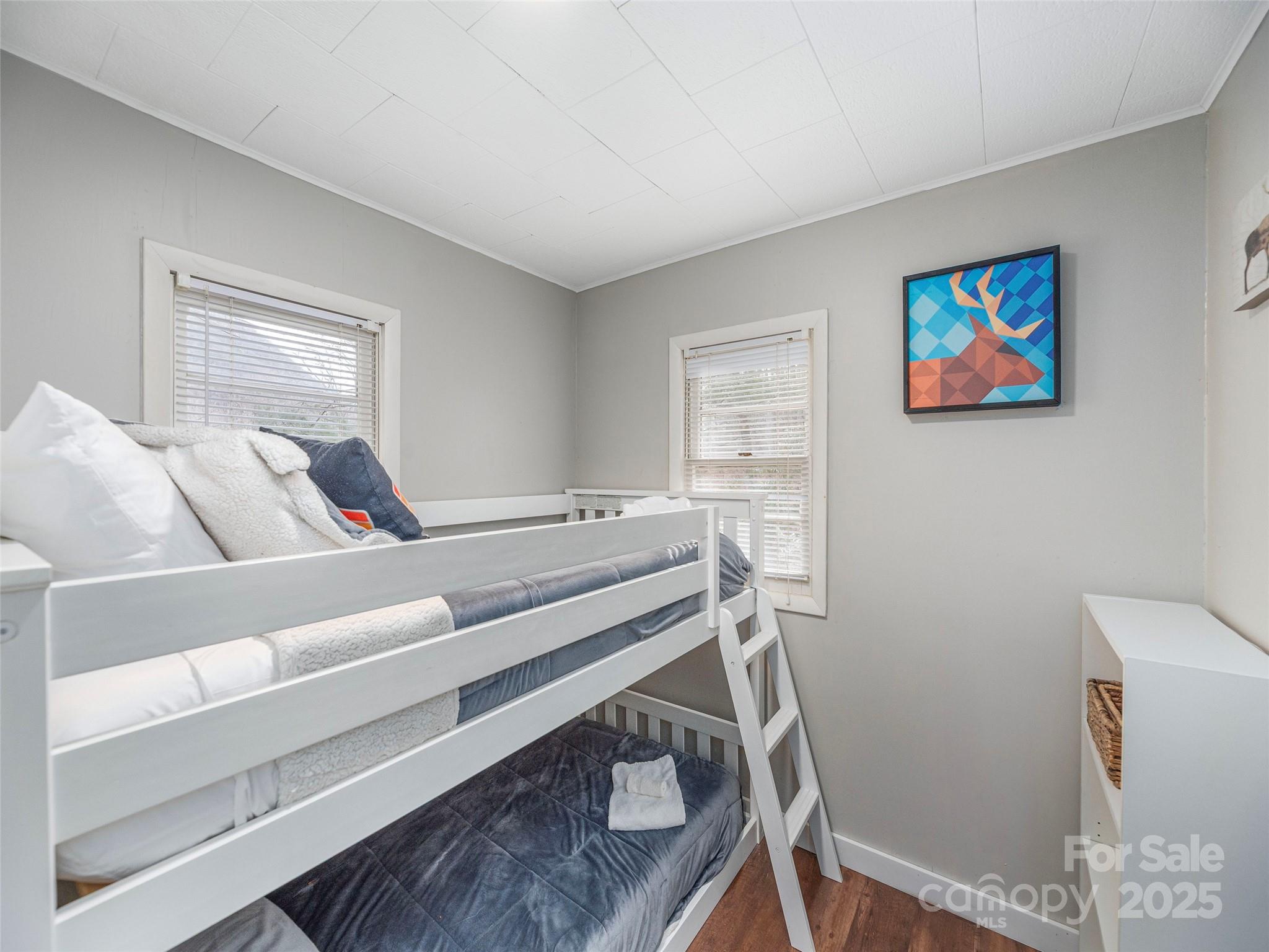 155 Mull Cove Road Maggie Valley, NC 28751 - Photo 13 of 19 a bedroom with a bed and furniture