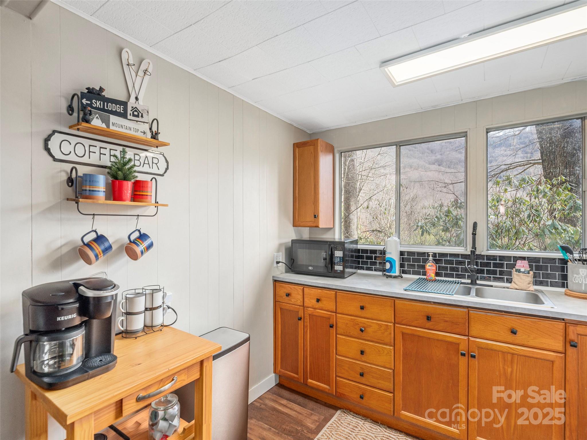 155 Mull Cove Road Maggie Valley, NC 28751 - Photo 5 of 19 a kitchen with sink a stove and a window
