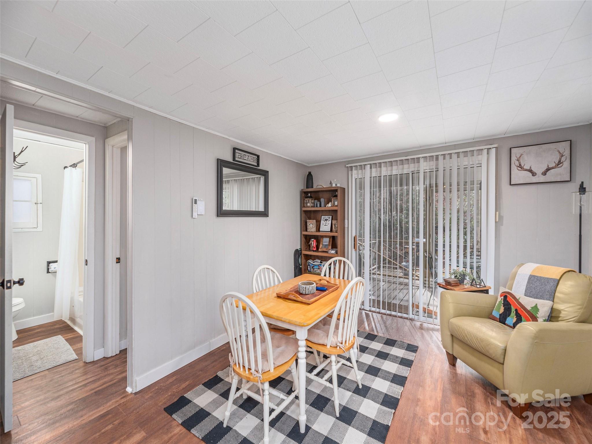 155 Mull Cove Road Maggie Valley, NC 28751 - Photo 9 of 19 a living room with furniture and wooden floor