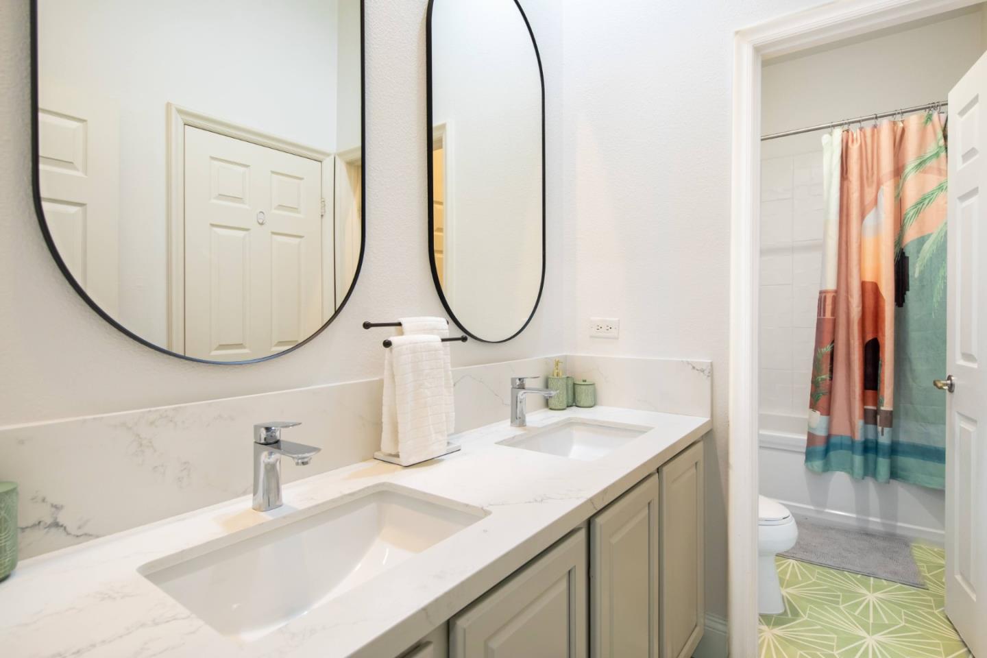 49133 Jordan Street Indio, CA 92201 - Photo 38 of 60 a bathroom with a sink and a mirror