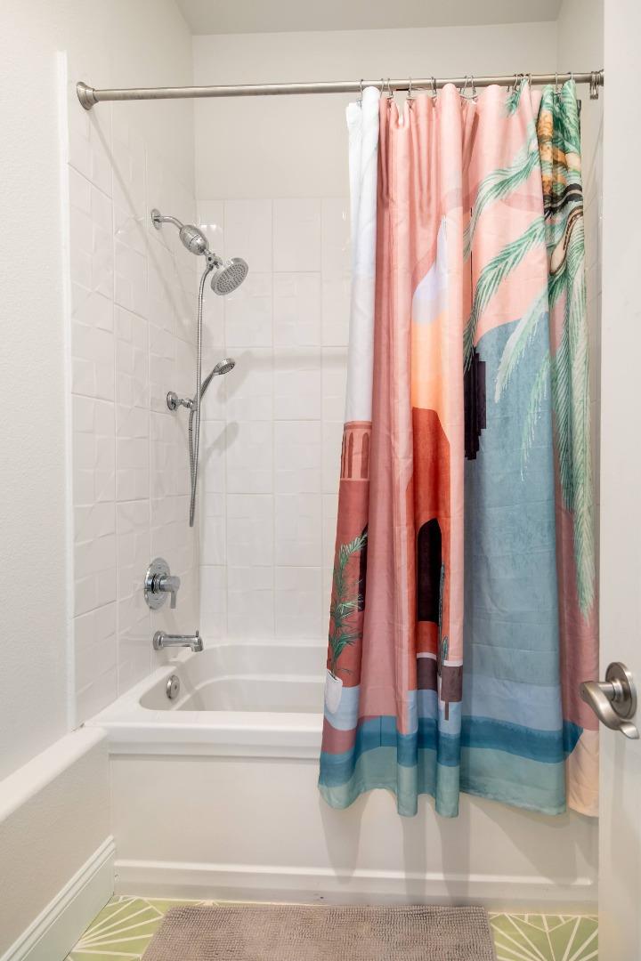 49133 Jordan Street Indio, CA 92201 - Photo 39 of 60 a bathroom with a bathtub and a shower