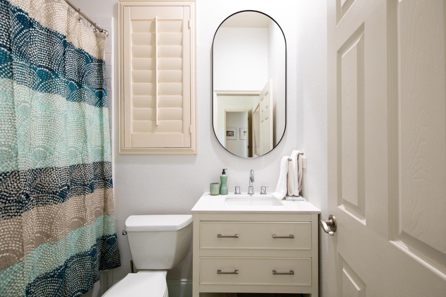 49133 Jordan Street Indio, CA 92201 - Photo 47 of 60 a bathroom with a sink mirror and a toilet