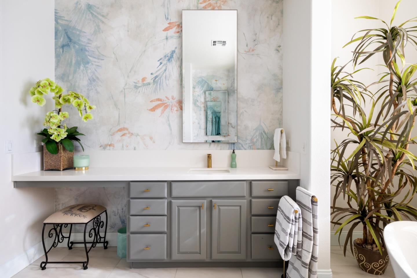 49133 Jordan Street Indio, CA 92201 - Photo 52 of 60 a bathroom with a sink a mirror and a potted plant
