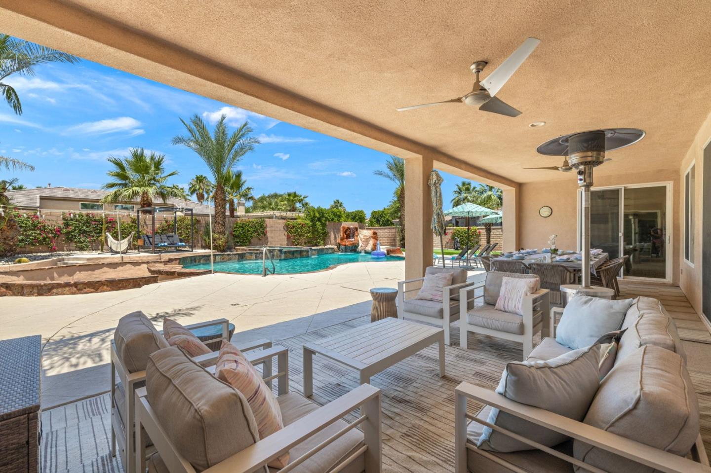 49133 Jordan Street Indio, CA 92201 - Photo 59 of 60 a outdoor space with patio lots of furniture and iron fence