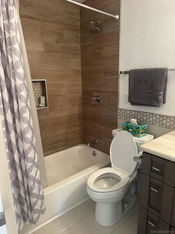 a bathroom with a toilet a sink and bathtub