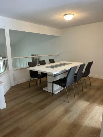 a view of a workspace and wooden floor
