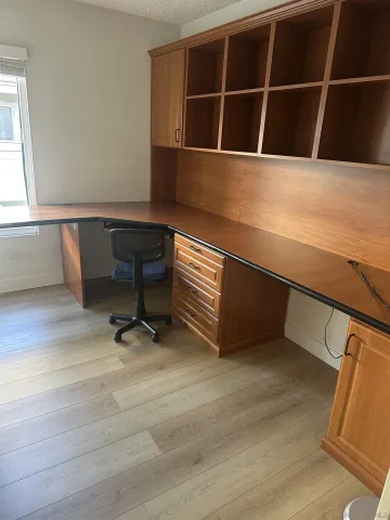 a room with table chair and wooden floor