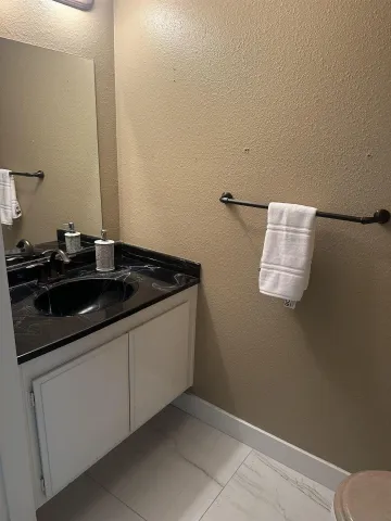 a kitchen with a sink and a stove top oven