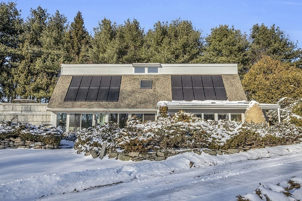296 Boston Road Groton, MA 01450 - Photo 2 of 42 an aerial view of a house with a yard and lake view