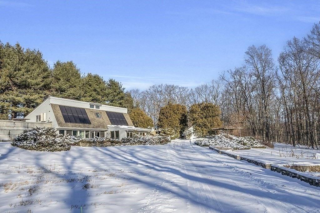 296 Boston Road Groton, MA 01450 - Photo 36 of 42 a view of a house with a yard