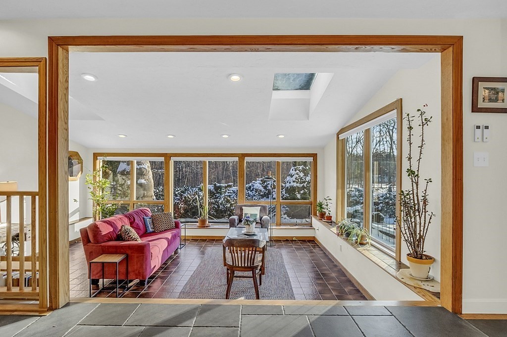 296 Boston Road Groton, MA 01450 - Photo 4 of 42 a living room with furniture and floor to ceiling windows