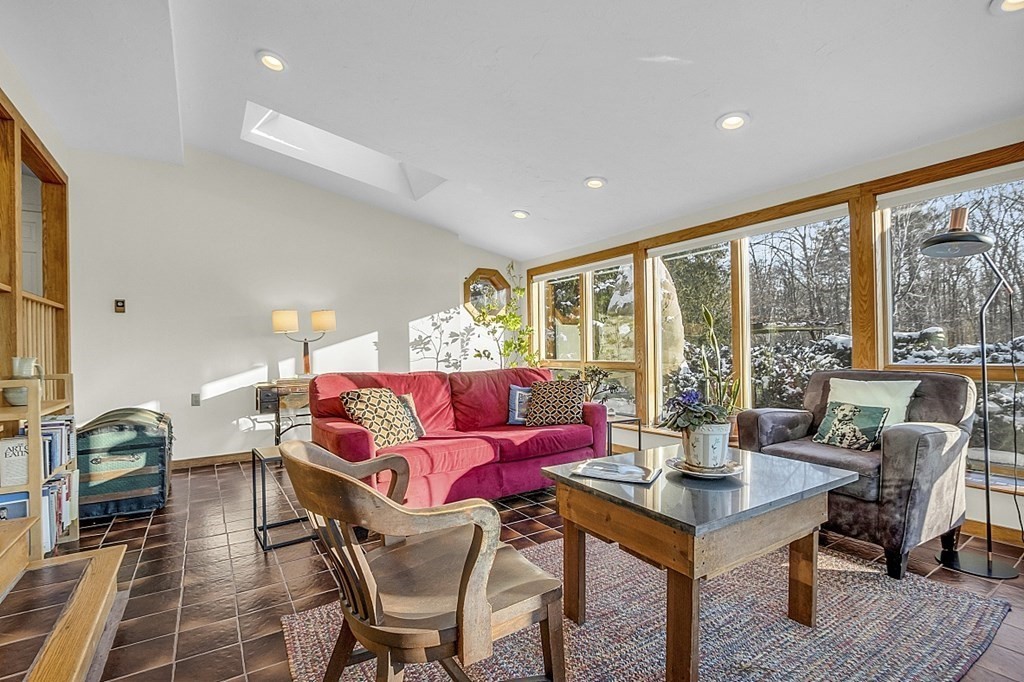 296 Boston Road Groton, MA 01450 - Photo 5 of 42 a living room with furniture and a floor to ceiling window