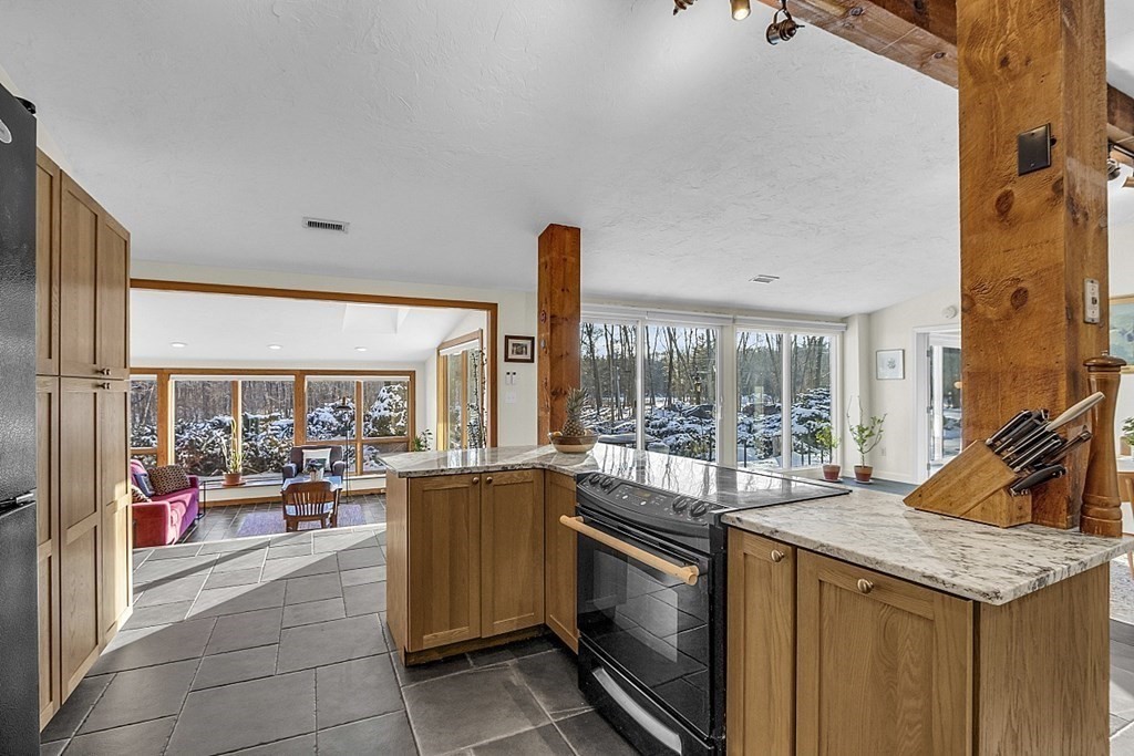 296 Boston Road Groton, MA 01450 - Photo 6 of 42 a kitchen with a stove and large window