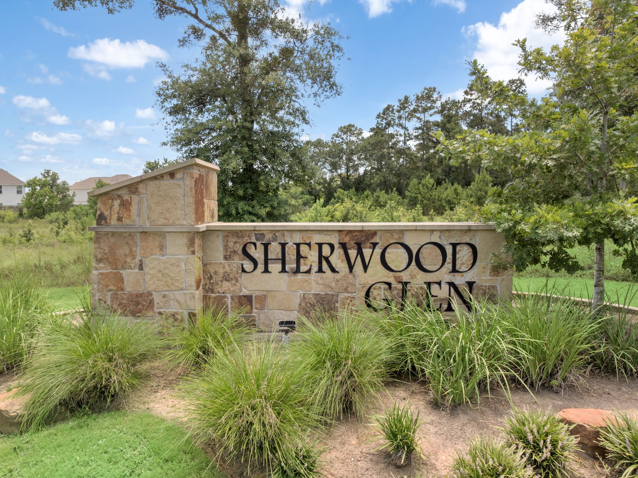 17817 Lionheart Road Conroe, TX 77306 - Photo 19 of 23 a sign of golf club on a wall under a tree