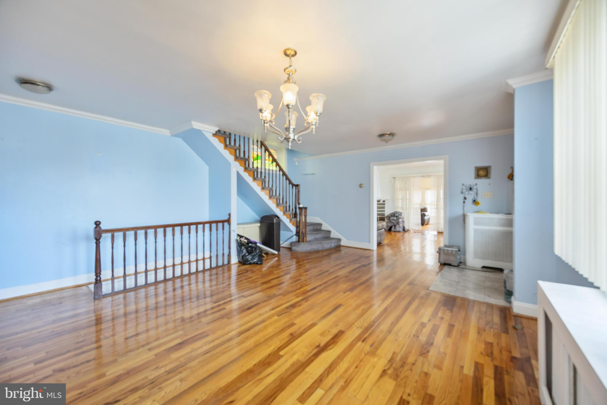 537 Elm Avenue Upper Darby, PA 19082 - Photo 12 of 30 a view of a livingroom with wooden floor and stairs