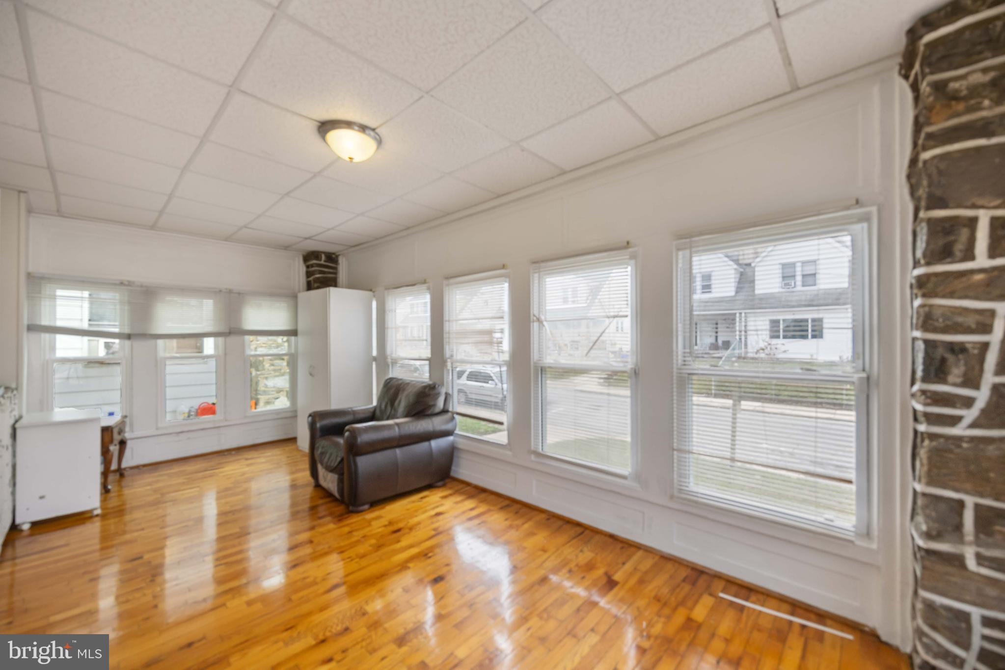 537 Elm Avenue Upper Darby, PA 19082 - Photo 5 of 30 a living room with furniture and floor to ceiling windows