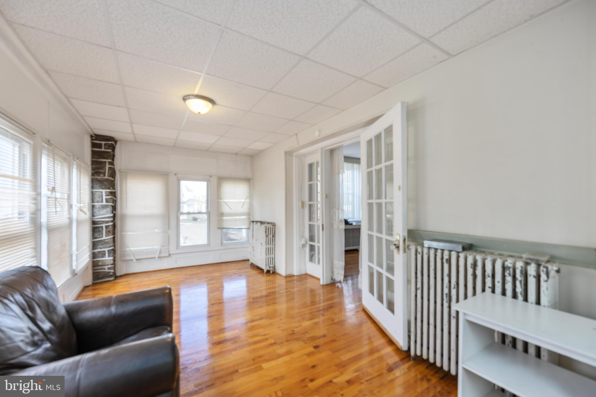 537 Elm Avenue Upper Darby, PA 19082 - Photo 6 of 30 a living room with furniture and wooden floor