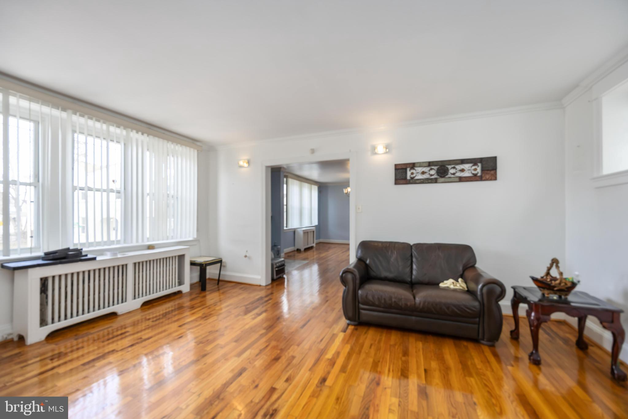 537 Elm Avenue Upper Darby, PA 19082 - Photo 7 of 30 a living room with furniture and a wooden floor