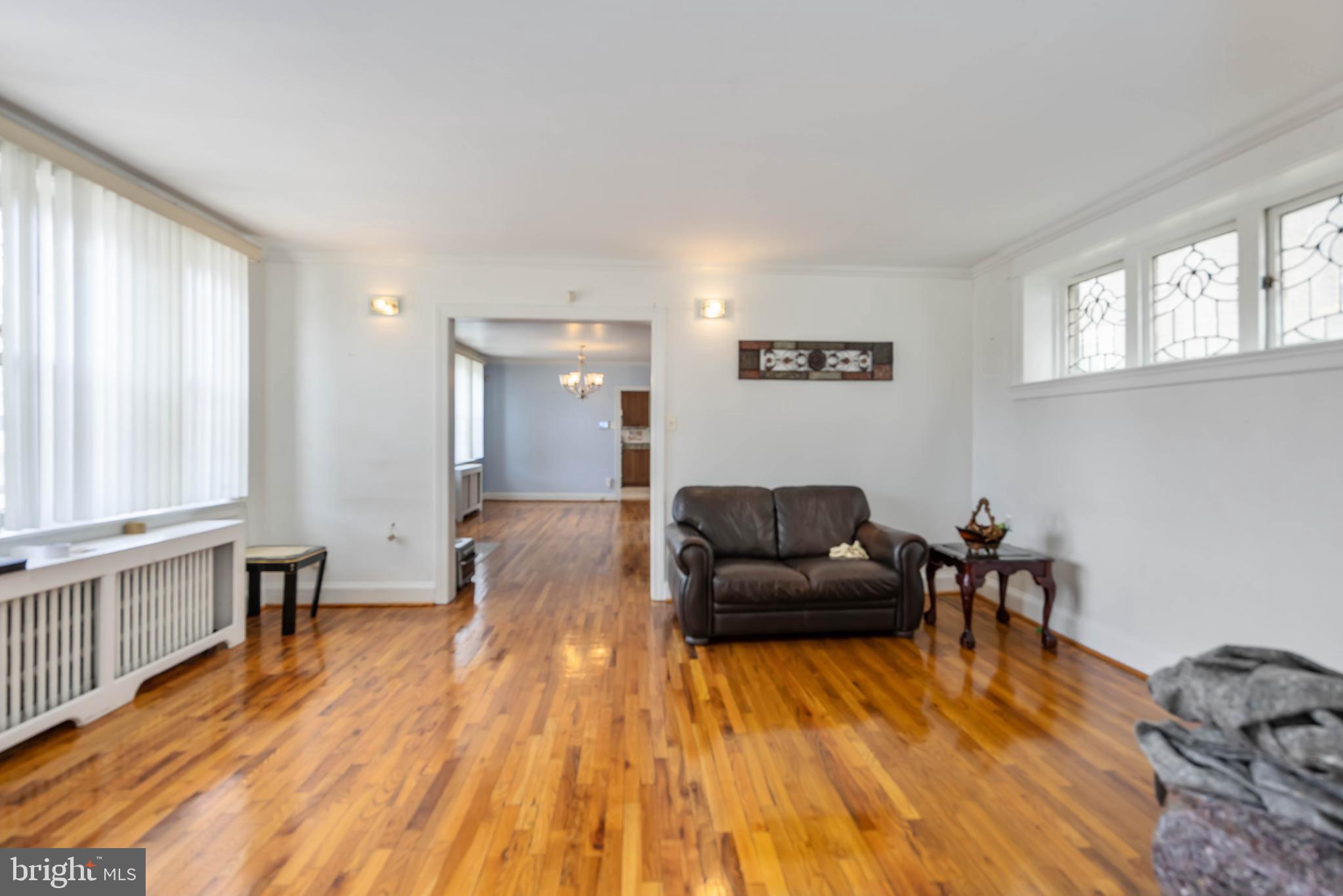 537 Elm Avenue Upper Darby, PA 19082 - Photo 8 of 30 a living room with furniture and a wooden floor