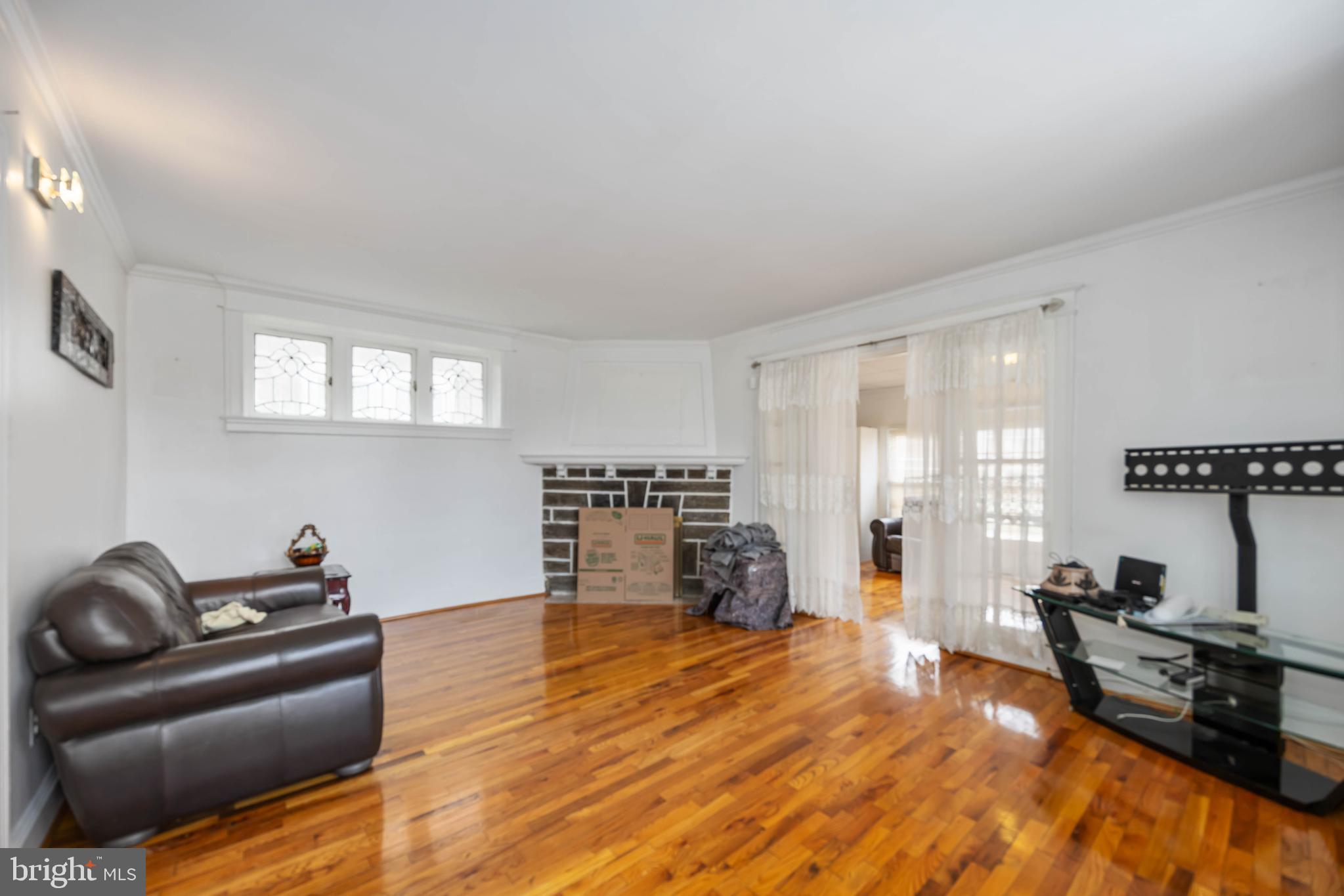 537 Elm Avenue Upper Darby, PA 19082 - Photo 9 of 30 a living room with furniture and a flat screen tv