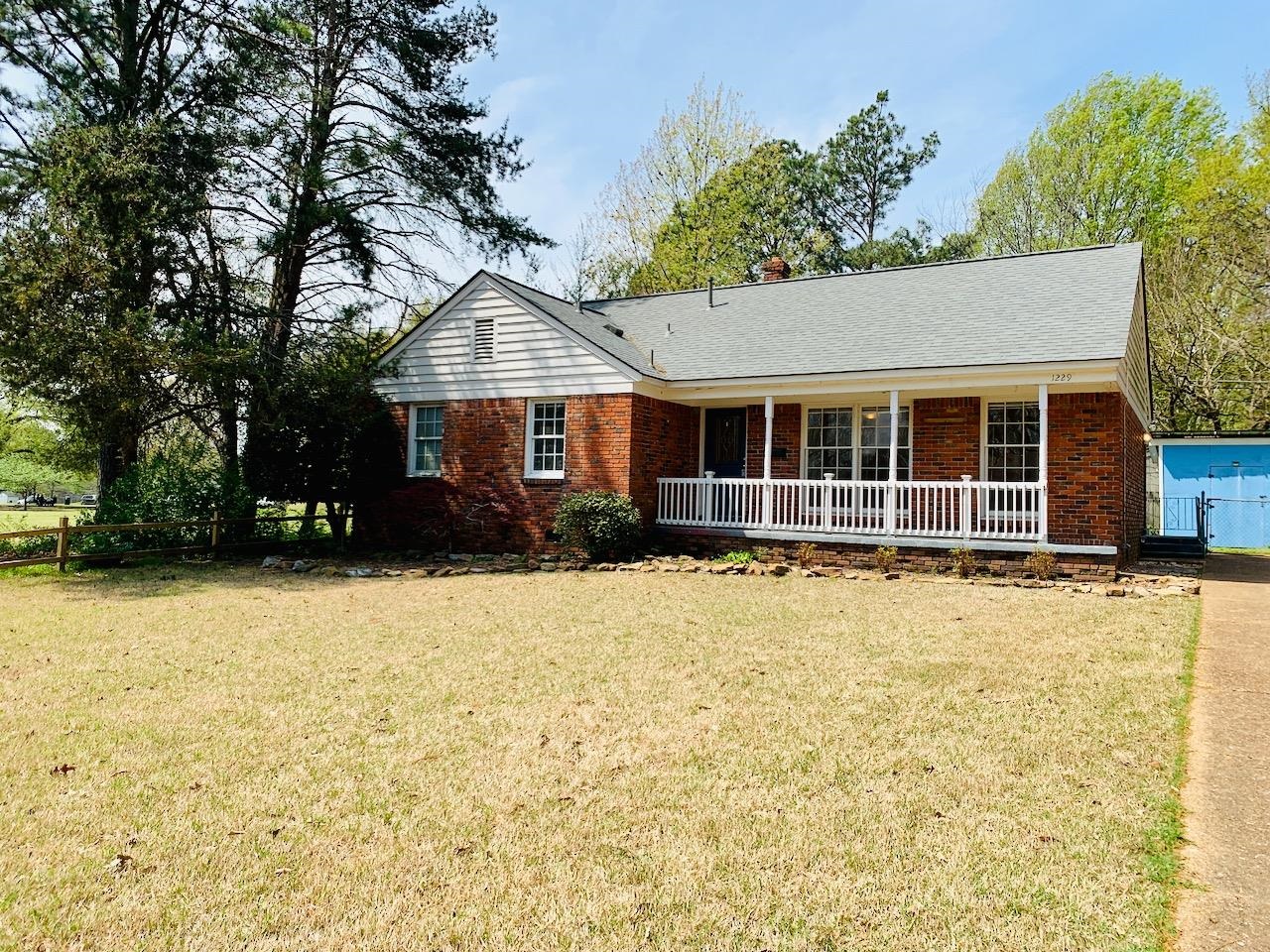 front view of a house with a yard