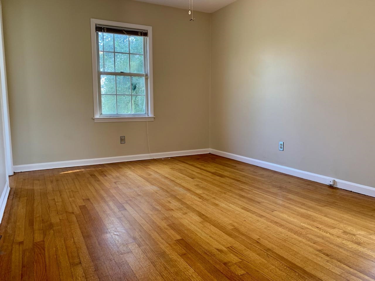 1229 Wilmore Road Memphis, TN 38117 - Photo 13 of 20 a view of empty room with wooden floor and fan