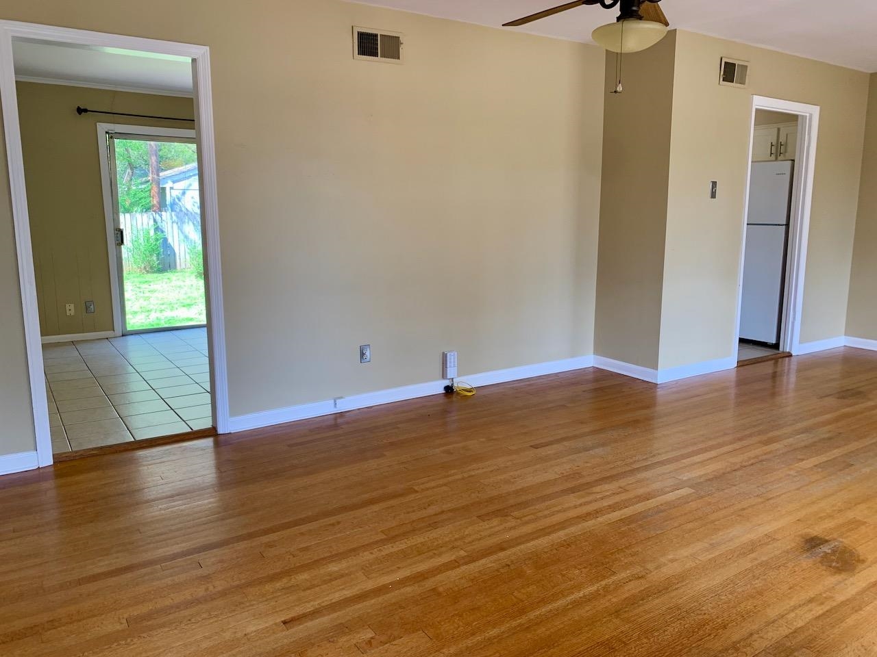 1229 Wilmore Road Memphis, TN 38117 - Photo 6 of 20 an empty room with wooden floor and closet