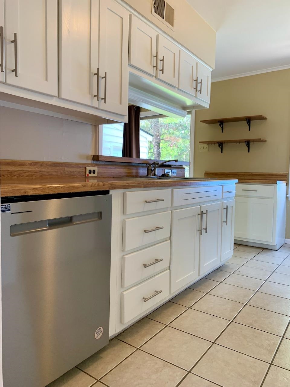 1229 Wilmore Road Memphis, TN 38117 - Photo 7 of 20 a kitchen with granite countertop white cabinets and a sink