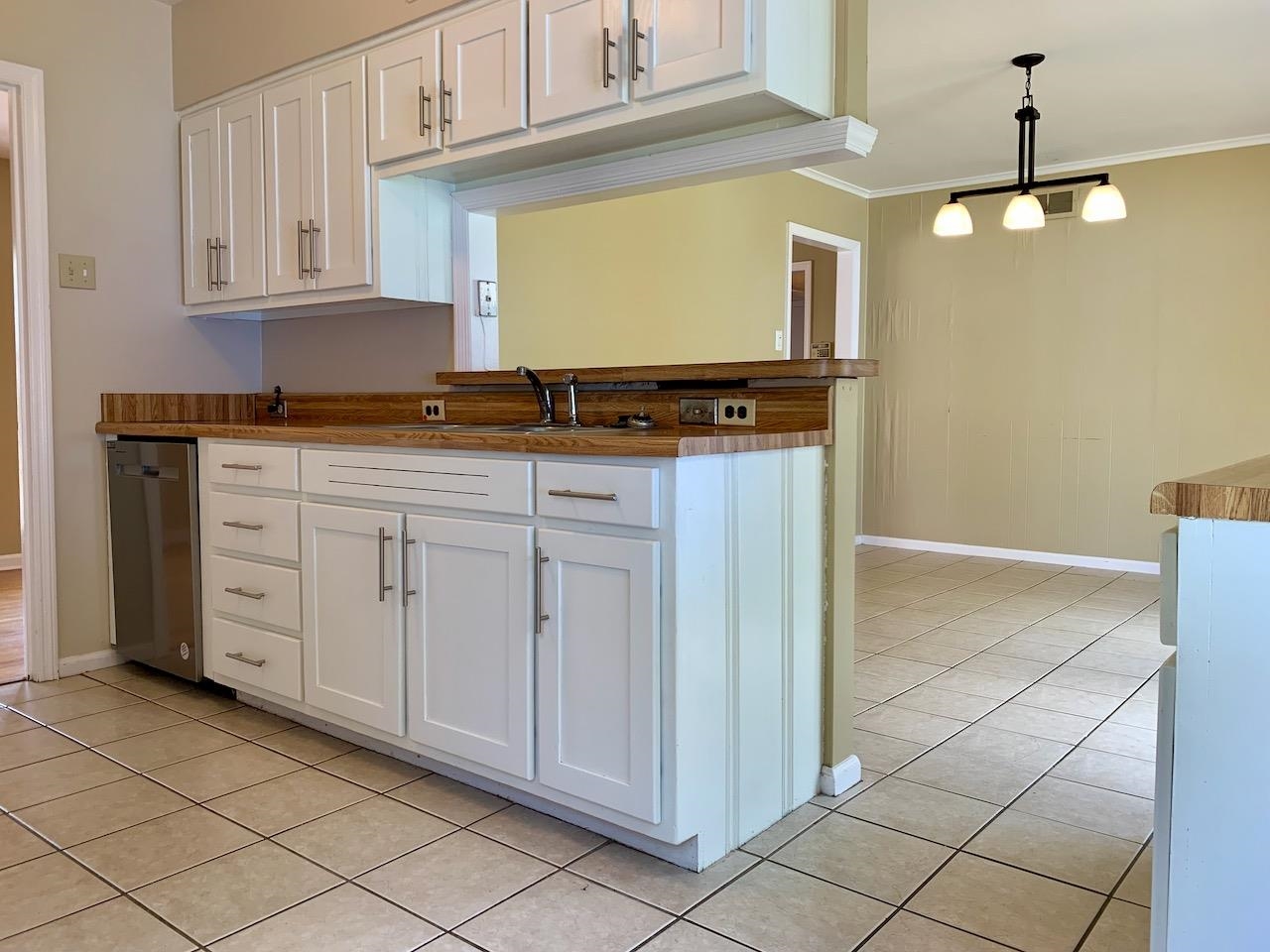 1229 Wilmore Road Memphis, TN 38117 - Photo 8 of 20 a kitchen with cabinets and window