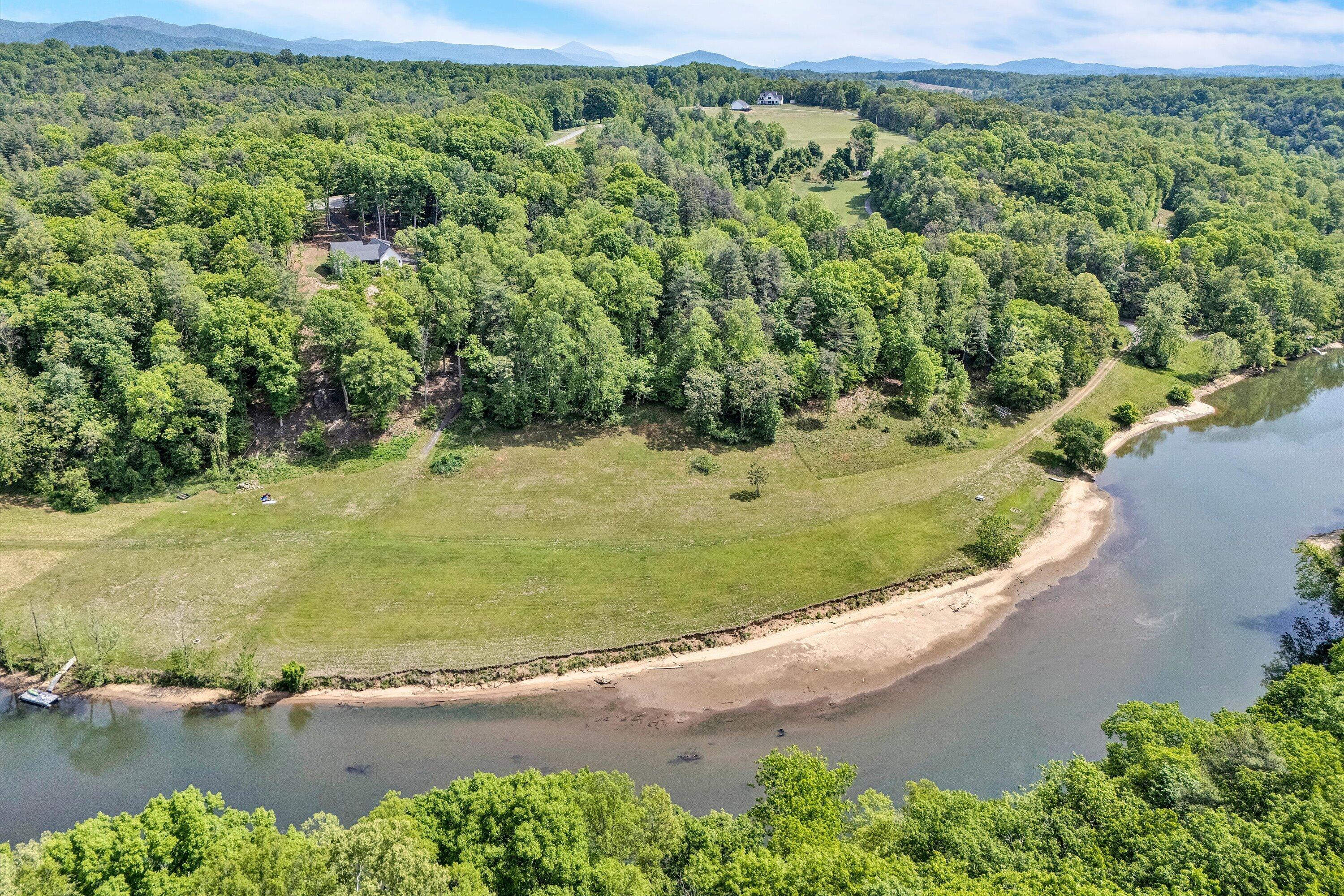 Lot 26 River Rock Road Vinton, VA 24179 - Photo 2 of 28 an aerial view of a houses with a yard and lake