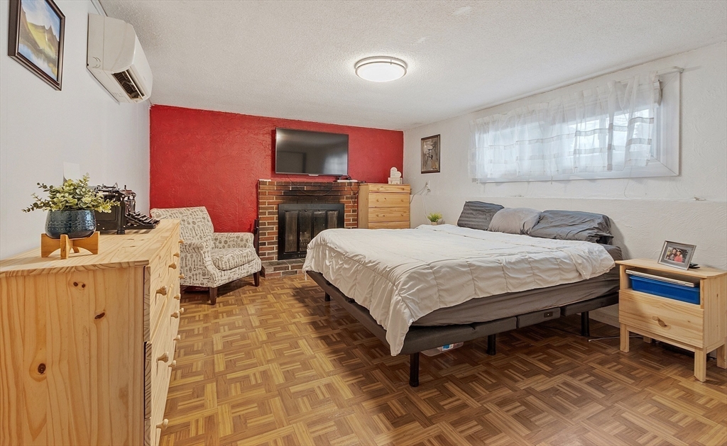 2 Edith Road Hudson, MA 01749 - Photo 16 of 23 a bedroom with a bed and a couch